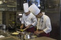 Two chefs preparing homemade pasta i