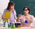 Two chemists students in classroom Royalty Free Stock Photo