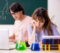 Two chemists students in classroom Royalty Free Stock Photo