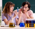 Two chemists students in classroom Royalty Free Stock Photo