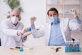 Two male chemists working at the lab during pandemic Royalty Free Stock Photo