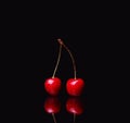 two cherries on black Royalty Free Stock Photo