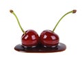 Two cherries filled with hot chocolate on white background Royalty Free Stock Photo