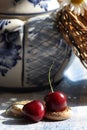 Two cherries in rustic russian interior details Royalty Free Stock Photo