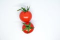 Two cherry tomatoes on white background Royalty Free Stock Photo