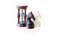 Two chess horses with sand-clock Royalty Free Stock Photo