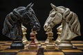 Two chess knights face each other in a tense moment on the chessboard Royalty Free Stock Photo