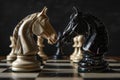 Two chess knights face each other in a tense moment on the chessboard Royalty Free Stock Photo