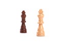 Two chess pieces. Black and white king of wood with blurred background - Isolated on white Royalty Free Stock Photo