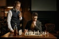 Two chess players taking break for smoking cigars Royalty Free Stock Photo