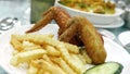 Two chicken wings and fries Royalty Free Stock Photo