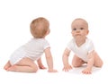 Two child baby toddlers sitting crawling happy Royalty Free Stock Photo