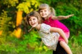Two child girls playing together. Sisters play Superhero. Happy kids having fun, smiling and hugging. Royalty Free Stock Photo