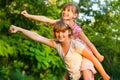 Two child girls playing together. Sisters play Superhero. Happy kids having fun, smiling and hugging. Royalty Free Stock Photo