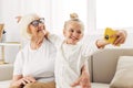 Call sofa granddaughter child video selfie hugging family bonding smiling togetherness phone grandmother education Royalty Free Stock Photo