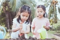 Two children asian little girl having fun to prepare soil