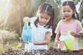 Two children asian little girl having fun to prepare soil Royalty Free Stock Photo