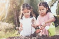 Two children asian little girl having fun to prepare soil Royalty Free Stock Photo