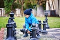 Two children, boy brothers, playing chess with huge figures in t Royalty Free Stock Photo