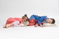 Two children - brother and sister in pajamas lie on pillows and pretend to be asleep Royalty Free Stock Photo