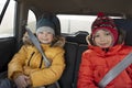 Two children in the car a merry winter trip Royalty Free Stock Photo