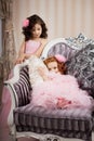 Two children on a chair in a nice dress Royalty Free Stock Photo