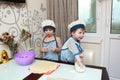 Two Children Cooking dumplings