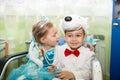 Two children dressed in carnival suits in New Year's holiday