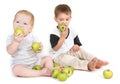 Two children eating green apples Royalty Free Stock Photo