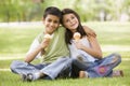 Two children eating ice cream in park Royalty Free Stock Photo