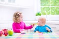 Two children eating yoghurt Royalty Free Stock Photo