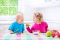 Two children eating yoghurt Royalty Free Stock Photo