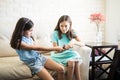 Two children fighting over the remote control Royalty Free Stock Photo