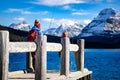 Two children fishing off a dock near Banff Canada Royalty Free Stock Photo