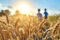 Two children friends cousins running through wheat field joy freedom in nature summer spring happiness childhood games Royalty Free Stock Photo