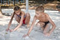 Two children, girl and boy having fun together in nature. Brother and sister happy friendly play together.