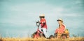 Two Children having fun in field against blue sky background. Happy children farmers working with spud on spring field Royalty Free Stock Photo