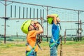 Two children in helmets and safety gear are looking up in an extreme park Royalty Free Stock Photo