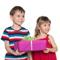 Two children hold a gift box