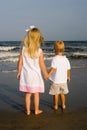 Two Children Holding Hands at the Beach