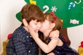 Children kissing at Christmas Royalty Free Stock Photo