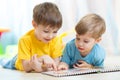 Two children looking at book Royalty Free Stock Photo