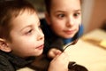 Two children looking at fork Royalty Free Stock Photo