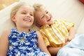 Two Children Lying Upside Down On Sofa At Home Royalty Free Stock Photo