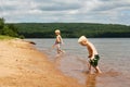 Two Children PLaying on Beach at Lake Superior Royalty Free Stock Photo