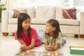 Two Children Playing Board Game At Home Royalty Free Stock Photo