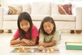 Two Children Playing Board Game At Home Royalty Free Stock Photo