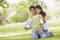 Two children playing football in park Royalty Free Stock Photo