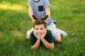 Two children are playing in the park. Two beautiful boys in T-shirts and shorts have fun smiling. They eat ice cream Royalty Free Stock Photo