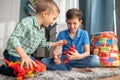 Two children playing with rubber animal figures Royalty Free Stock Photo